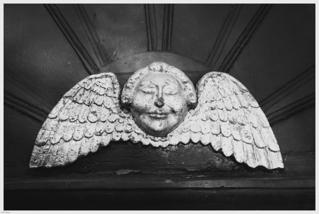 Cherub above St. Luke's church door in Charlton